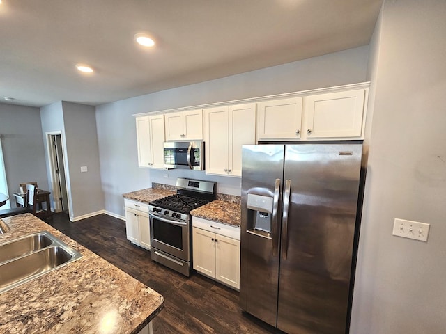 1847 Southern Cir, Pingree Grove, IL 60140 - kitchen featuring stainless steel appliances, white cabinetry, dark wood-style flooring, recessed lighting, and dark stone counters