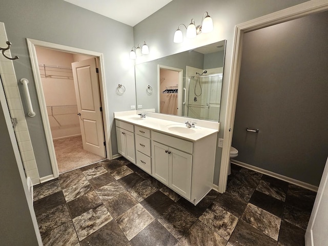 1847 Southern Cir, Pingree Grove, IL 60140 - full bath featuring a walk in closet, double vanity, stone tile floors, and a shower stall
