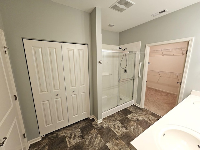 1847 Southern Cir, Pingree Grove, IL 60140 - full bathroom featuring a stall shower, double vanity, and a spacious closet