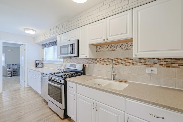 6124 Chase Ave, Downers Grove, IL 60516 - kitchen featuring stainless steel appliances, light countertops, white cabinets, and decorative backsplash