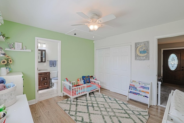6124 Chase Ave, Downers Grove, IL 60516 - bedroom with attic access, light wood-type flooring, a closet, connected bathroom, and a ceiling fan