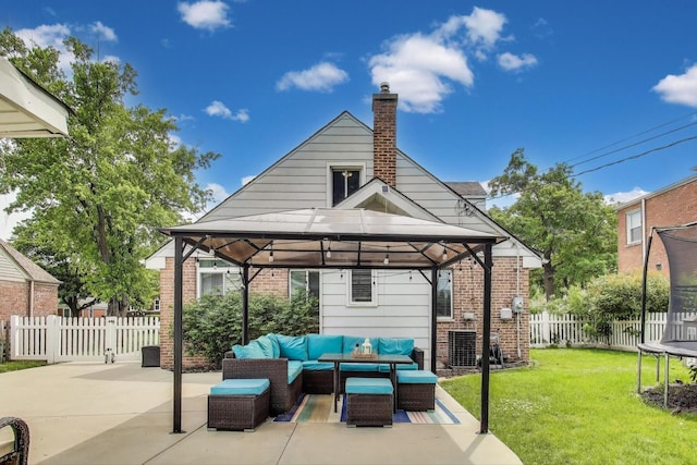 614 Beach Ave, La Grange Park, IL 60526 - fenced backyard featuring a gazebo, an outdoor living space, a trampoline, and a patio