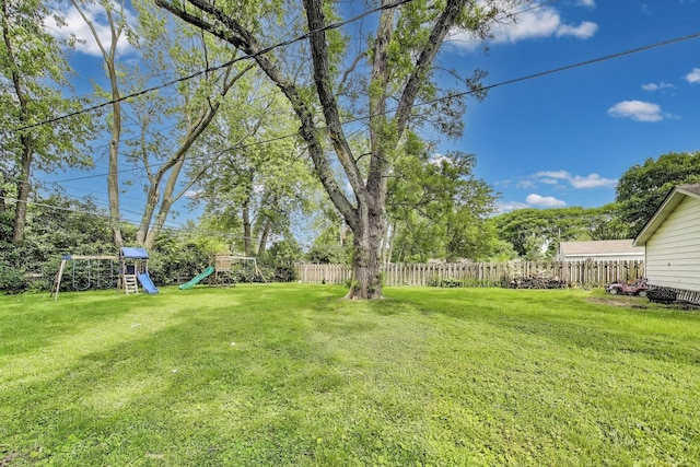 614 Beach Ave, La Grange Park, IL 60526 - fenced backyard featuring a playground