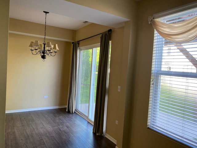 3148 Ollerton Ave Unit 3148, Aurora, IL 60502 - unfurnished dining area with dark wood-type flooring, a chandelier, and baseboards