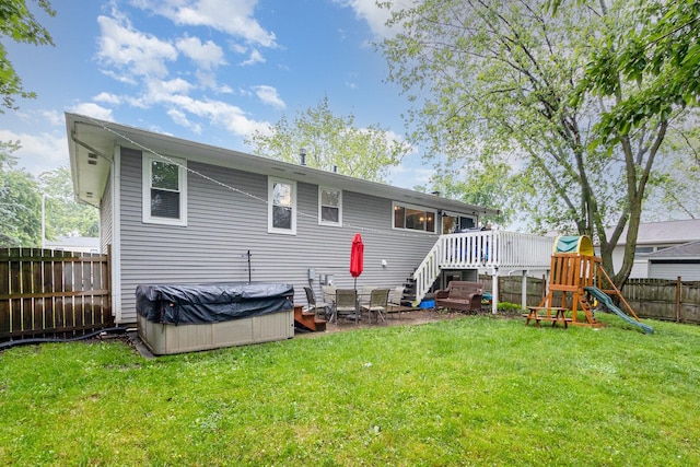 352 Falcon Ridge Way, Bolingbrook, IL 60440 - back of property featuring a hot tub, a playground, and a deck