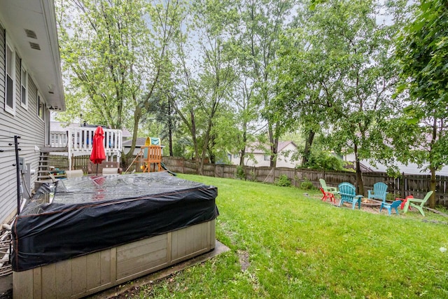 352 Falcon Ridge Way, Bolingbrook, IL 60440 - view of yard featuring an outdoor fire pit and a deck