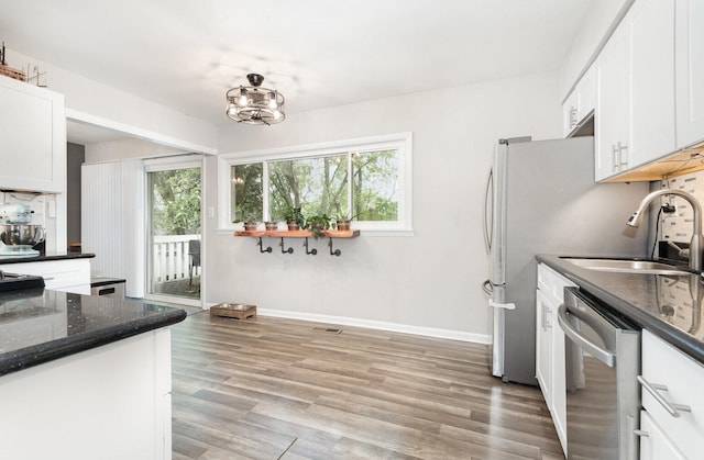 352 Falcon Ridge Way, Bolingbrook, IL 60440 - kitchen featuring stainless steel appliances, white cabinetry, light wood finished floors, and a sink