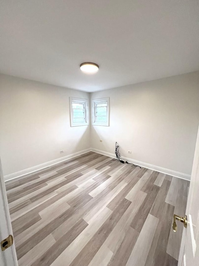 6842 W Lode Dr Unit 3B, Worth, IL 60482 - empty room with wood finished floors and baseboards