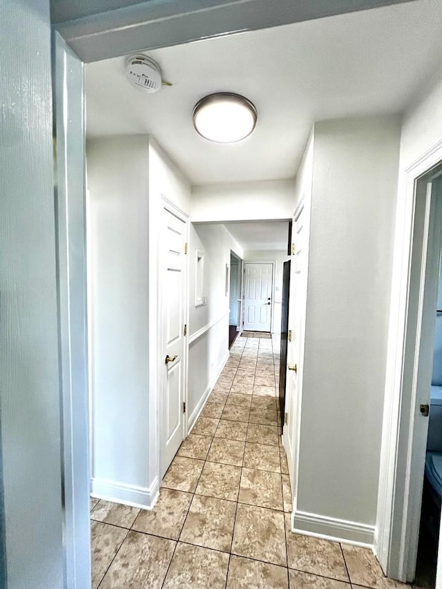 6842 W Lode Dr Unit 3B, Worth, IL 60482 - corridor with baseboards and light tile patterned flooring