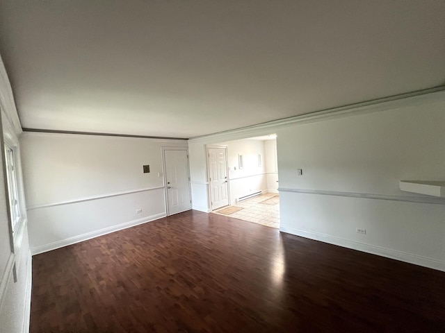 6842 W Lode Dr Unit 3B, Worth, IL 60482 - empty room featuring a baseboard heating unit, wood finished floors, baseboards, and ornamental molding