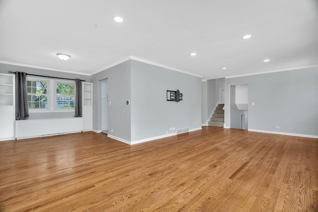 308 Tamarack Ave, Naperville, IL 60540 - unfurnished room featuring crown molding, light wood finished floors, stairway, recessed lighting, and baseboards