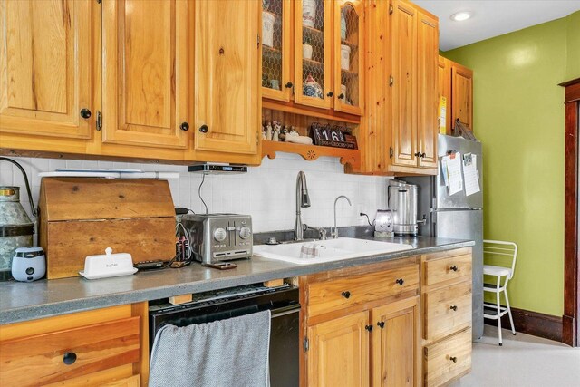 138 N Elm St, Paxton, IL 60957 - kitchen featuring dishwasher, a sink, decorative backsplash, glass insert cabinets, and recessed lighting