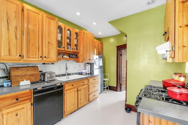 138 N Elm St, Paxton, IL 60957 - kitchen with black appliances, decorative backsplash, a sink, extractor fan, and recessed lighting