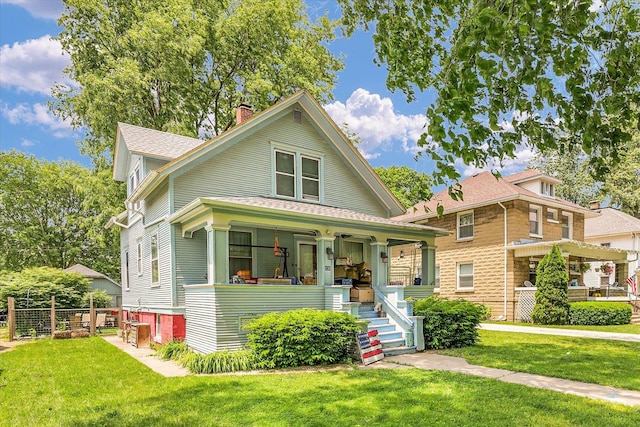 138 N Elm St, Paxton, IL 60957 - view of front of property with covered porch, a chimney, and roof with shingles