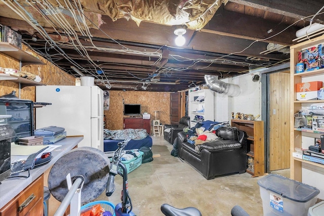 138 N Elm St, Paxton, IL 60957 - unfinished basement featuring freestanding refrigerator