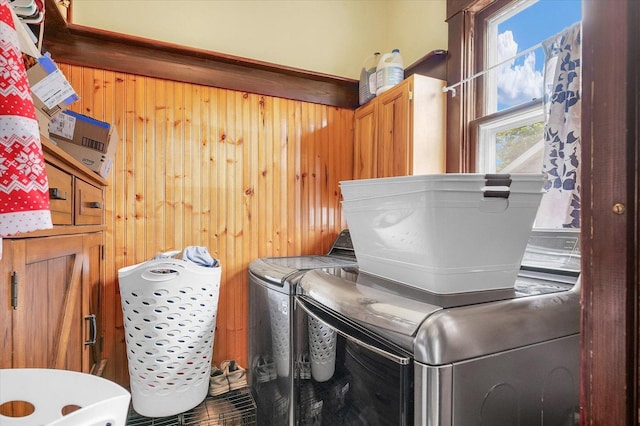 138 N Elm St, Paxton, IL 60957 - washroom featuring cabinet space, washer and clothes dryer, and wood walls