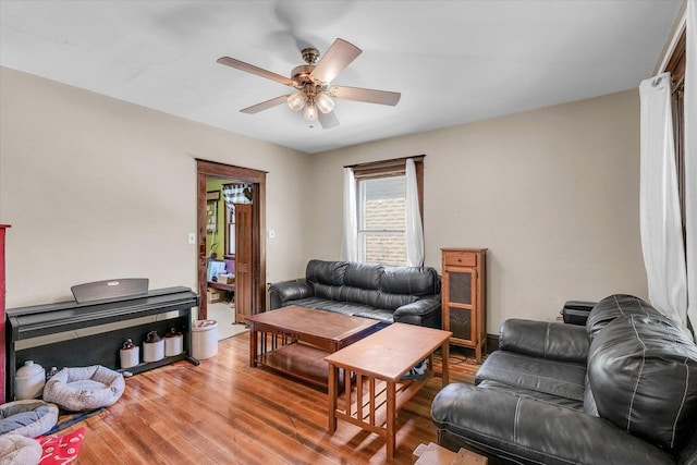 138 N Elm St, Paxton, IL 60957 - living area with a ceiling fan and light wood finished floors