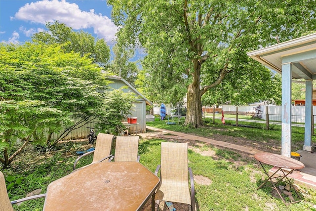 138 N Elm St, Paxton, IL 60957 - view of yard with an outdoor structure and a patio