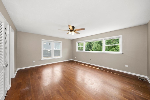 23951 N Lakeside Dr, Lake Zurich, IL 60047 - unfurnished bedroom with dark wood-style flooring and a ceiling fan