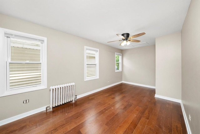 23951 N Lakeside Dr, Lake Zurich, IL 60047 - spare room featuring radiator, wood finished floors, and ceiling fan