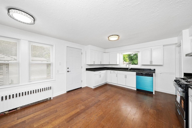 23951 N Lakeside Dr, Lake Zurich, IL 60047 - kitchen with dishwashing machine, radiator, gas range, dark wood-type flooring, and white cabinetry
