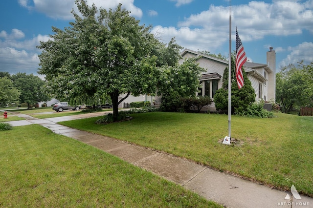 1710 Chestnut Hill Rd, Plainfield, IL 60586 - obstructed view of property with a front yard and a chimney