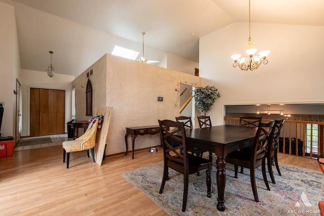 1710 Chestnut Hill Rd, Plainfield, IL 60586 - dining space with a chandelier, high vaulted ceiling, and light wood-type flooring