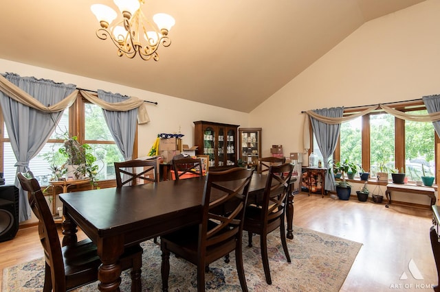 1710 Chestnut Hill Rd, Plainfield, IL 60586 - dining space featuring light wood-type flooring, a chandelier, plenty of natural light, and high vaulted ceiling