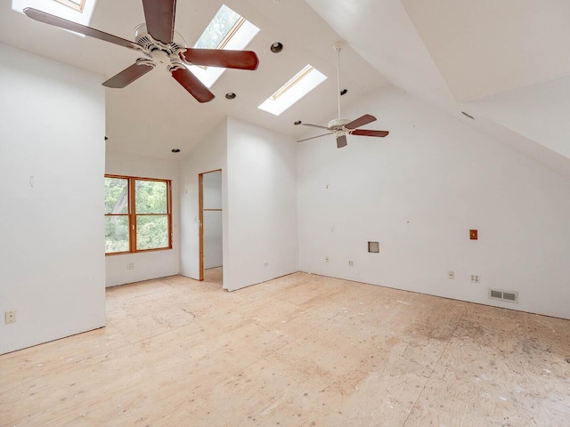4513 Schwartz Ave, Lisle, IL 60532 - spare room featuring a skylight, ceiling fan, and high vaulted ceiling