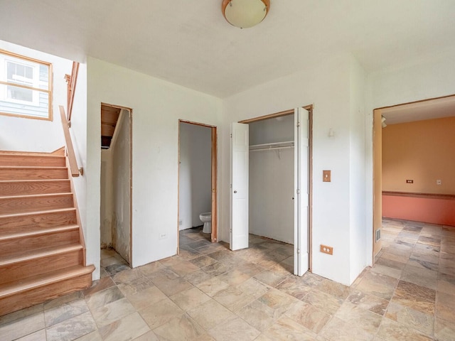 4513 Schwartz Ave, Lisle, IL 60532 - unfurnished bedroom with light stone finish floors