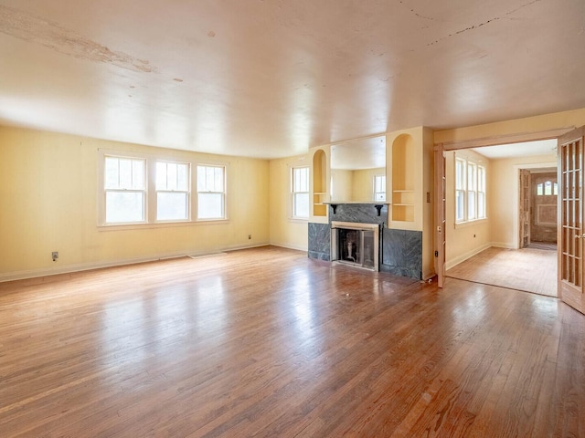 4513 Schwartz Ave, Lisle, IL 60532 - unfurnished living room with wood finished floors, baseboards, and a fireplace
