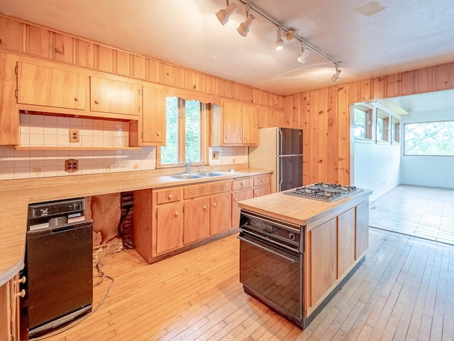 4513 Schwartz Ave, Lisle, IL 60532 - kitchen with stainless steel gas stovetop, oven, a sink, track lighting, and light countertops