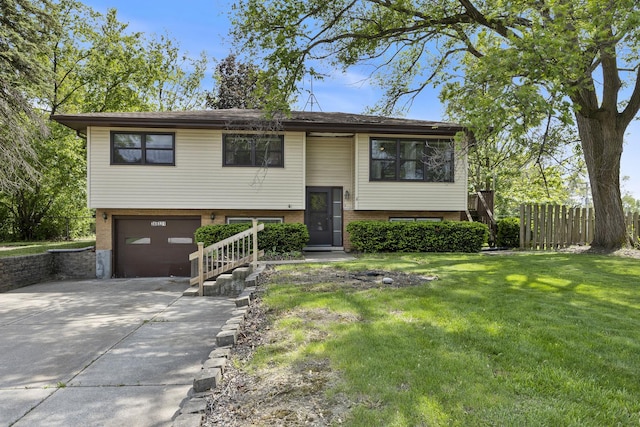 26W331 Geneva Rd, Wheaton, IL 60187 - raised ranch with driveway, an attached garage, and brick siding