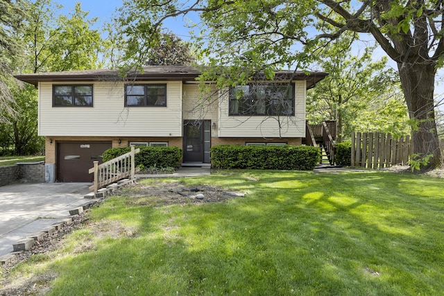 26W331 Geneva Rd, Wheaton, IL 60187 - split foyer home featuring concrete driveway, a garage, stairs, and brick siding