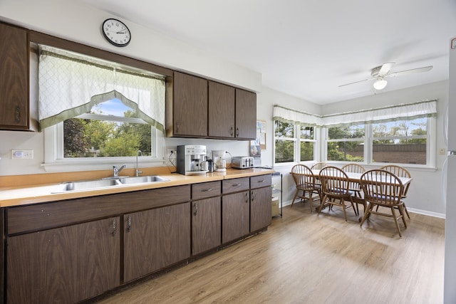 26W331 Geneva Rd, Wheaton, IL 60187 - kitchen with healthy amount of natural light, a sink, and light wood-style flooring
