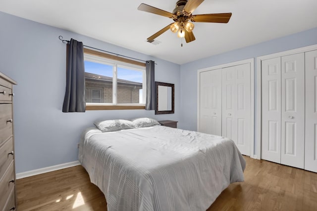 5739 W 63rd St Unit 3S, Chicago, IL 60638 - bedroom with two closets, wood finished floors, and a ceiling fan