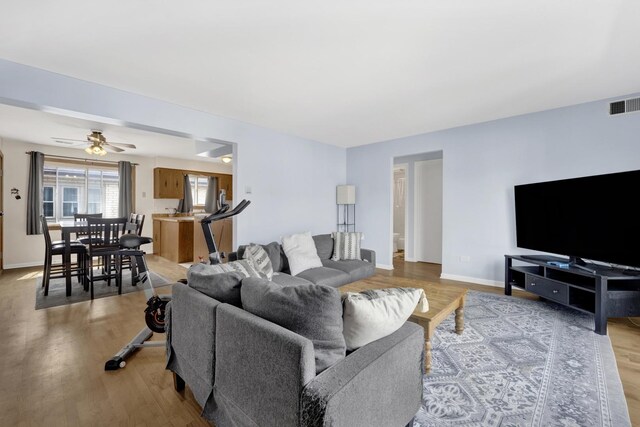 5739 W 63rd St Unit 3S, Chicago, IL 60638 - living room with light wood-style floors and a ceiling fan