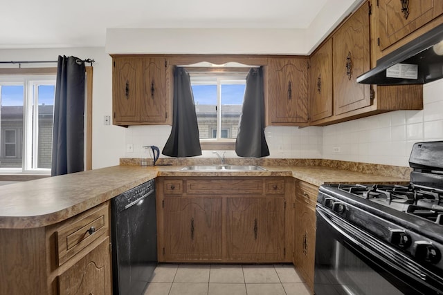 5739 W 63rd St Unit 3S, Chicago, IL 60638 - kitchen with black appliances, exhaust hood, light tile patterned floors, backsplash, and brown cabinetry