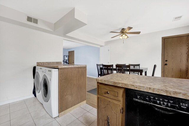 5739 W 63rd St Unit 3S, Chicago, IL 60638 - kitchen with black dishwasher, independent washer and dryer, a ceiling fan, light countertops, and light tile patterned floors