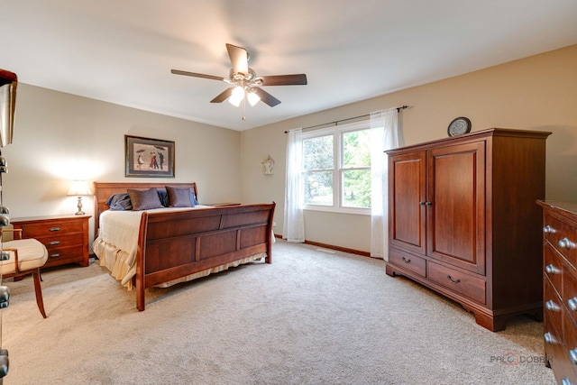 325 Pearl St, Cary, IL 60013 - bedroom with light carpet, ceiling fan, and baseboards