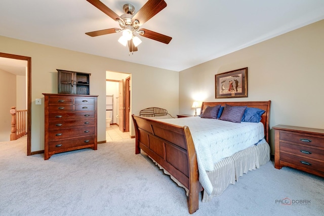 325 Pearl St, Cary, IL 60013 - bedroom with light colored carpet, ceiling fan, and connected bathroom