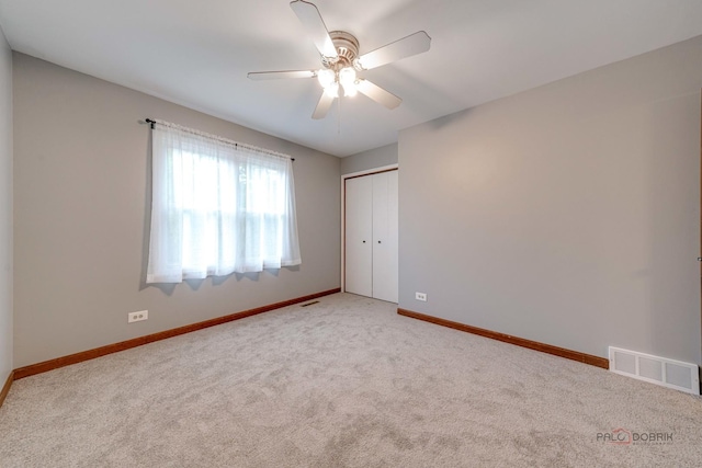 325 Pearl St, Cary, IL 60013 - empty room featuring light carpet, ceiling fan, and baseboards