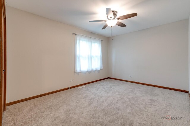 325 Pearl St, Cary, IL 60013 - carpeted empty room featuring ceiling fan and baseboards