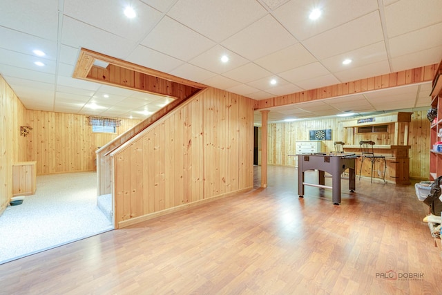 325 Pearl St, Cary, IL 60013 - recreation room featuring wooden walls, wood finished floors, a paneled ceiling, baseboards, and recessed lighting
