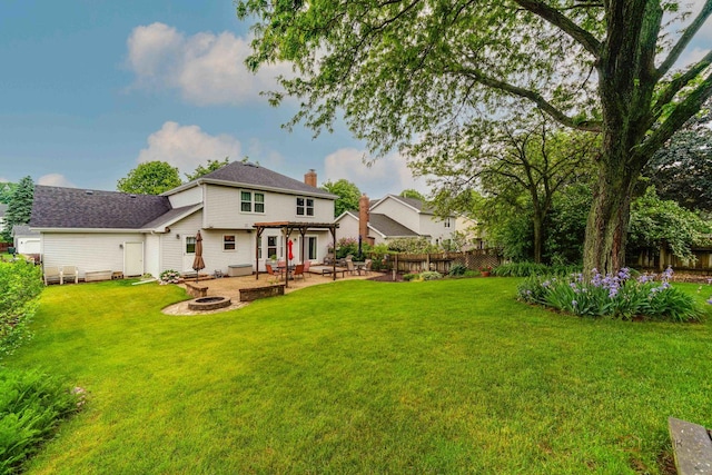 325 Pearl St, Cary, IL 60013 - back of house with a fire pit, a patio area, and a chimney