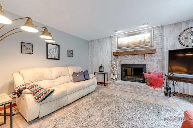 325 Pearl St, Cary, IL 60013 - living area with a fireplace, wood walls, stone finish flooring, and an accent wall