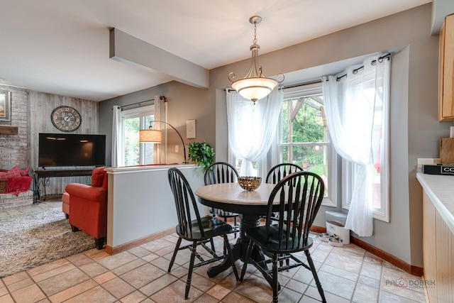 325 Pearl St, Cary, IL 60013 - dining area with plenty of natural light, stone tile flooring, and baseboards