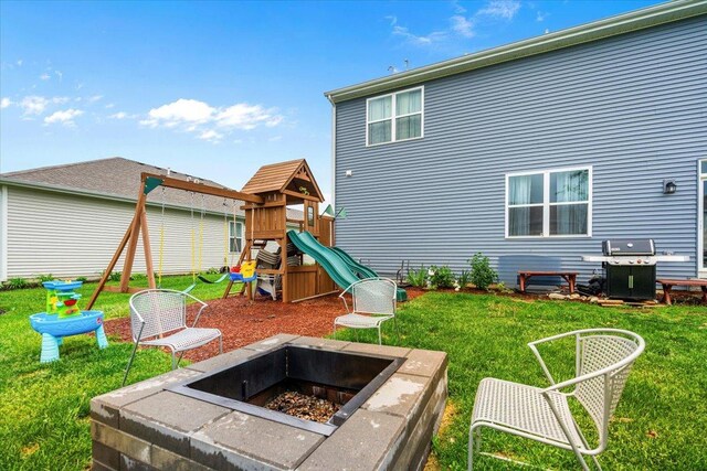 6904 Spruce Ct, Wonder Lake, IL 60097 - back of house with a lawn and a playground