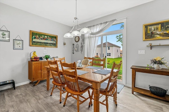6904 Spruce Ct, Wonder Lake, IL 60097 - dining area with light wood-style flooring and baseboards