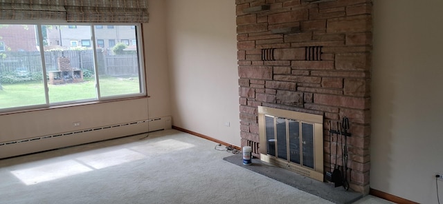 708 S Gretta Ave, Waukegan, IL 60085 - unfurnished living room with a baseboard radiator, carpet, plenty of natural light, and a stone fireplace